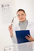 Optician doctor woman with glasses and eye chart