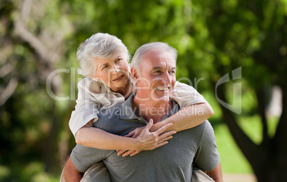 Man giving wife a piggyback