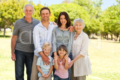 Family standing in the park