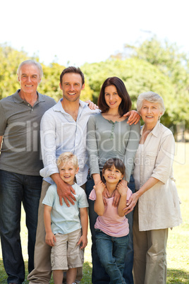 Family standing in the park