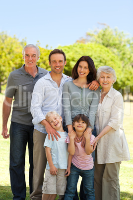 Family standing in the park