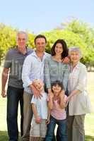 Family standing in the park