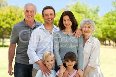 Family standing in the park