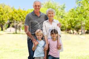 Grandparents with their grandchildren in the park