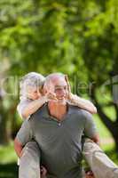 Man giving wife a piggyback