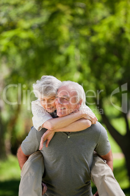 Man giving wife a piggyback