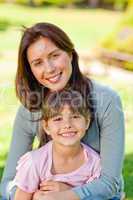 Happy mother with her daughter in the park