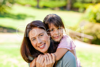 Happy mother with her daughter in the park