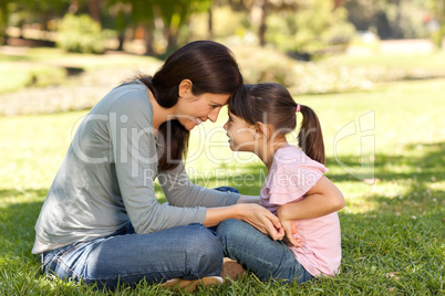 Happy mother with her daughter in the park