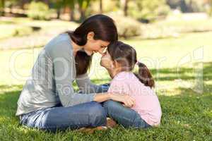 Happy mother with her daughter in the park