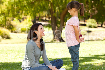 Joyful mother with her daughter in the park