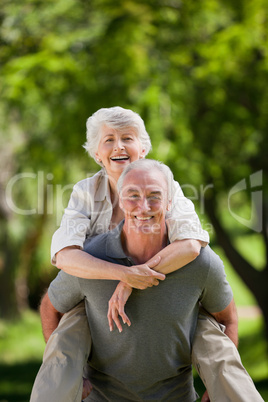 Man giving wife a piggyback