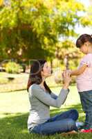 Beautiful mother with her daughter in the park