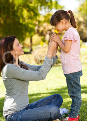 Beautiful mother with her daughter in the park