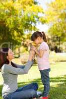 Beautiful mother with her daughter in the park