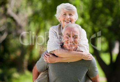 Man giving wife a piggyback