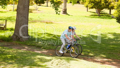 Retired couple mountain biking outside