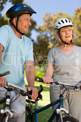 Elderly couple with their bikes