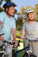 Elderly couple with their bikes