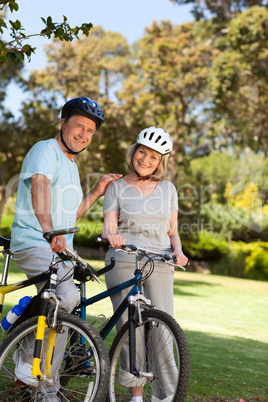 Elderly couple with their bikes