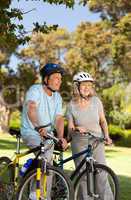 Elderly couple with their bikes