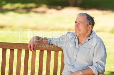 Elderly man sitting on a bench