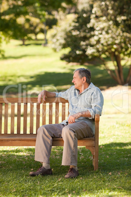 Elderly man sitting on a bench