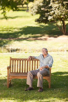 Elderly man sitting on a bench