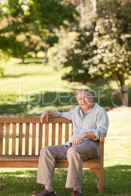 Elderly man sitting on a bench