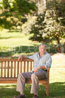 Elderly man sitting on a bench