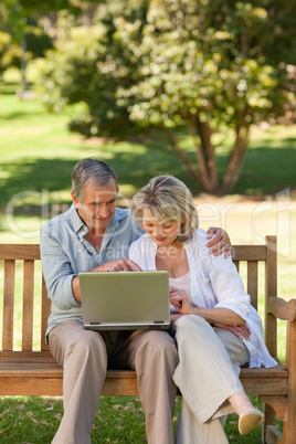 Senior couple working on their laptop