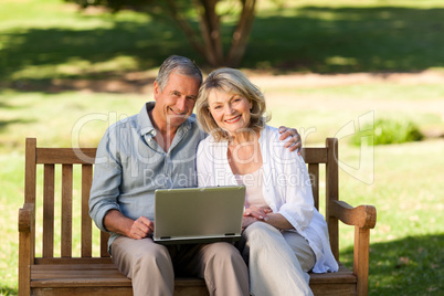 Senior couple working on their laptop