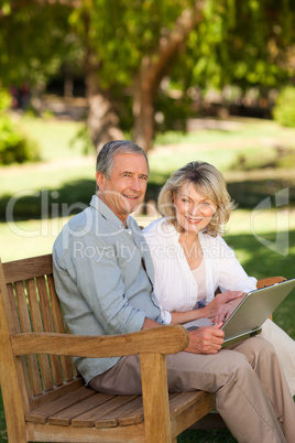 Senior couple working on their laptop