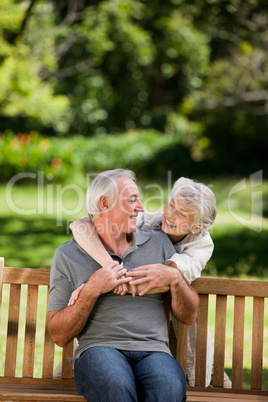 Mature couple hugging in the garden