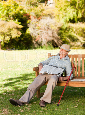 Senior man sleeping on the bench