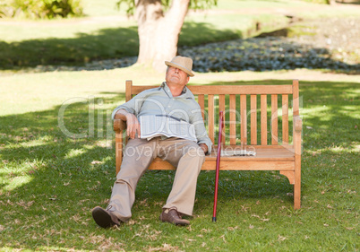 Senior man sleeping on the bench