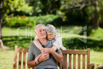 Mature couple hugging in the garden