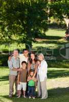 Family looking at the camera in the park