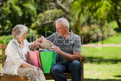 Retired couple with shopping bags