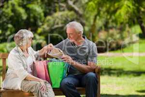 Retired couple with shopping bags
