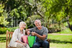 Retired couple with shopping bags