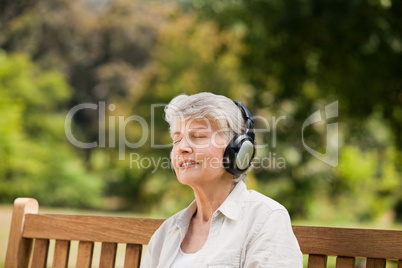 Elderly woman listening to some music