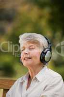 Elderly woman listening to some music