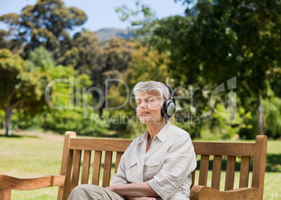 Elderly woman listening to some music