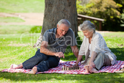 Mature couple  picnicking in the garden