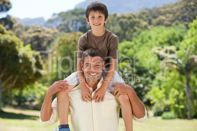 Man giving son a piggyback