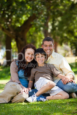 Joyful family sitting in the garden