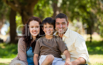 Joyful family sitting in the garden