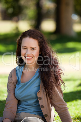 Lovely woman sitting in the garden