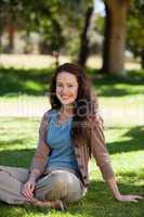 Lovely woman sitting in the garden